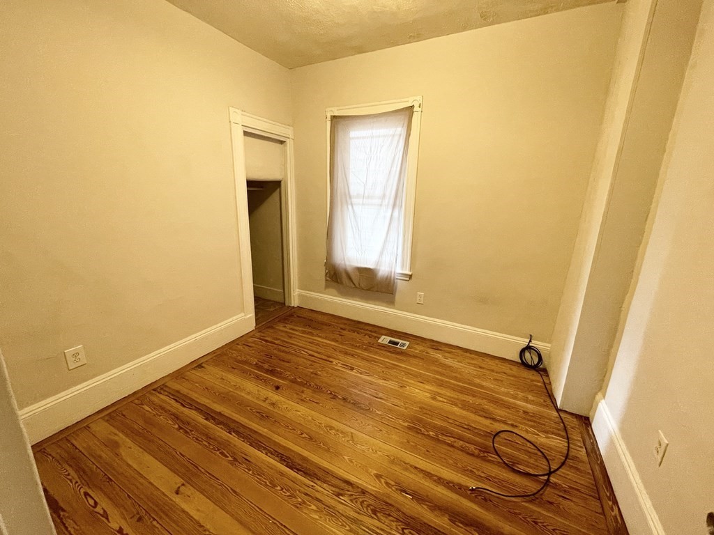 10 Wave Avenue, Unit 1 Boston, MA 02125 - Photo 7 of 9 a bathroom with a sink and a mirror