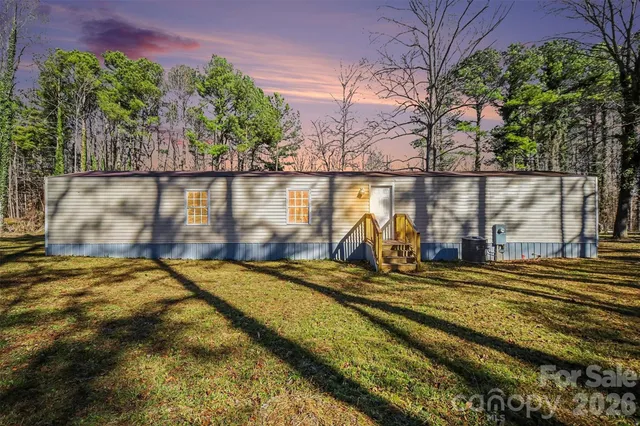 a view of a water pond with green space