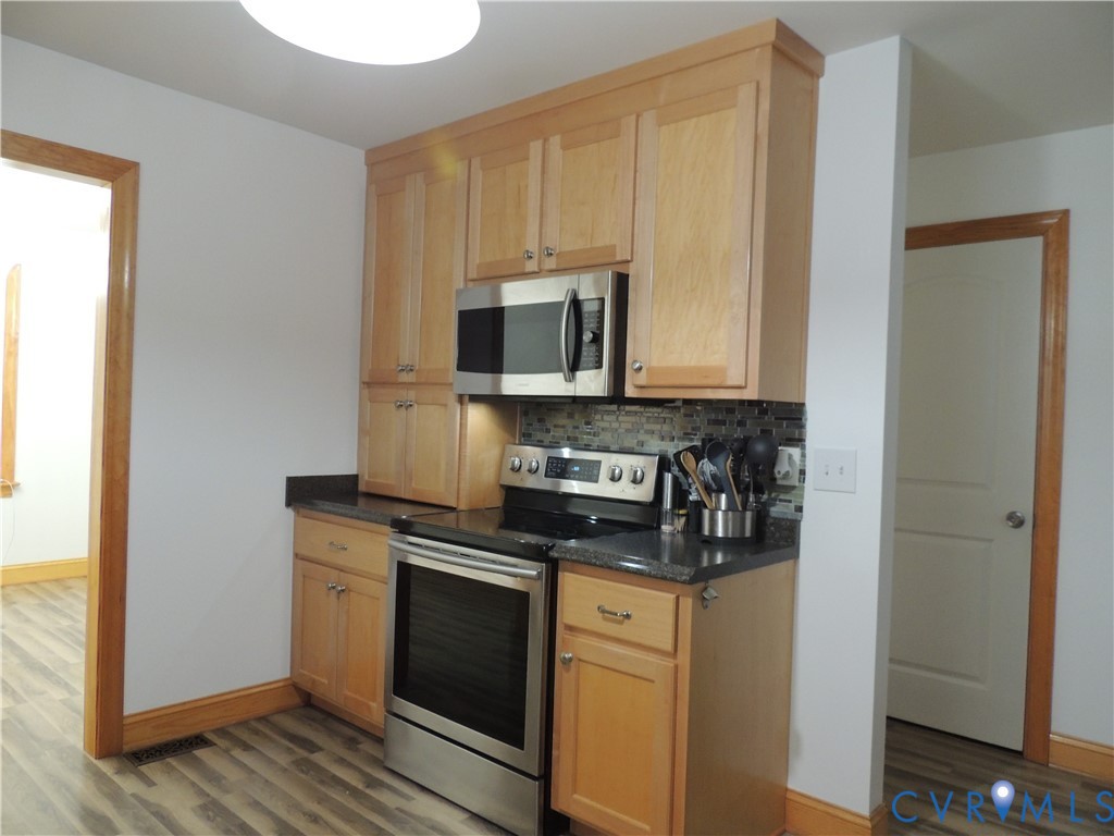 12512 Cox Road Church Road, VA 23833 - Photo 12 of 42 Kitchen featuring wood-finish cabinetry, stainless