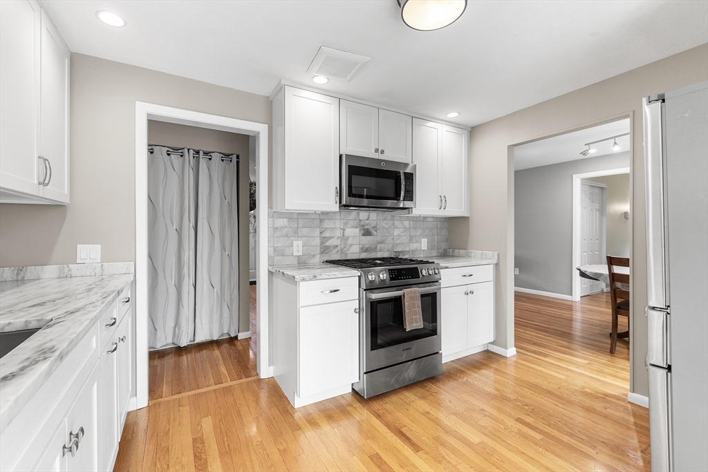 10 Livoli Road Framingham, MA 01701 - Photo 6 of 36 a kitchen with stainless steel appliances a stove a sink and a refrigerator