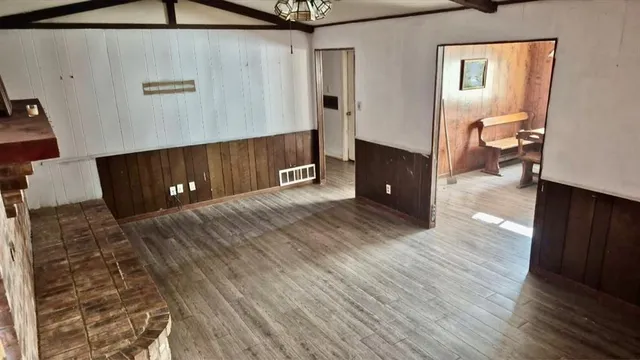 a view of a livingroom with wooden floor