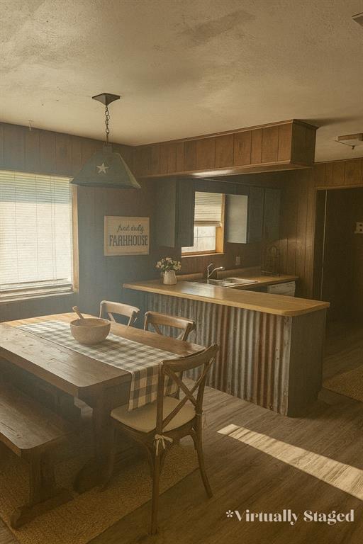 5193 County Road Blossom, TX 75416 - Photo 7 of 15 a dining room with a sink dishwasher a dining table and chairs with wooden floor