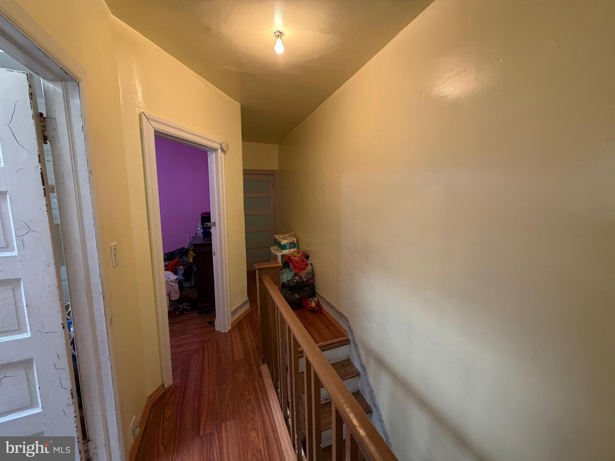 2033 South Bonsall Street Philadelphia, PA 19145 - Photo 12 of 31 a view of a hallway with wooden floor and stairs