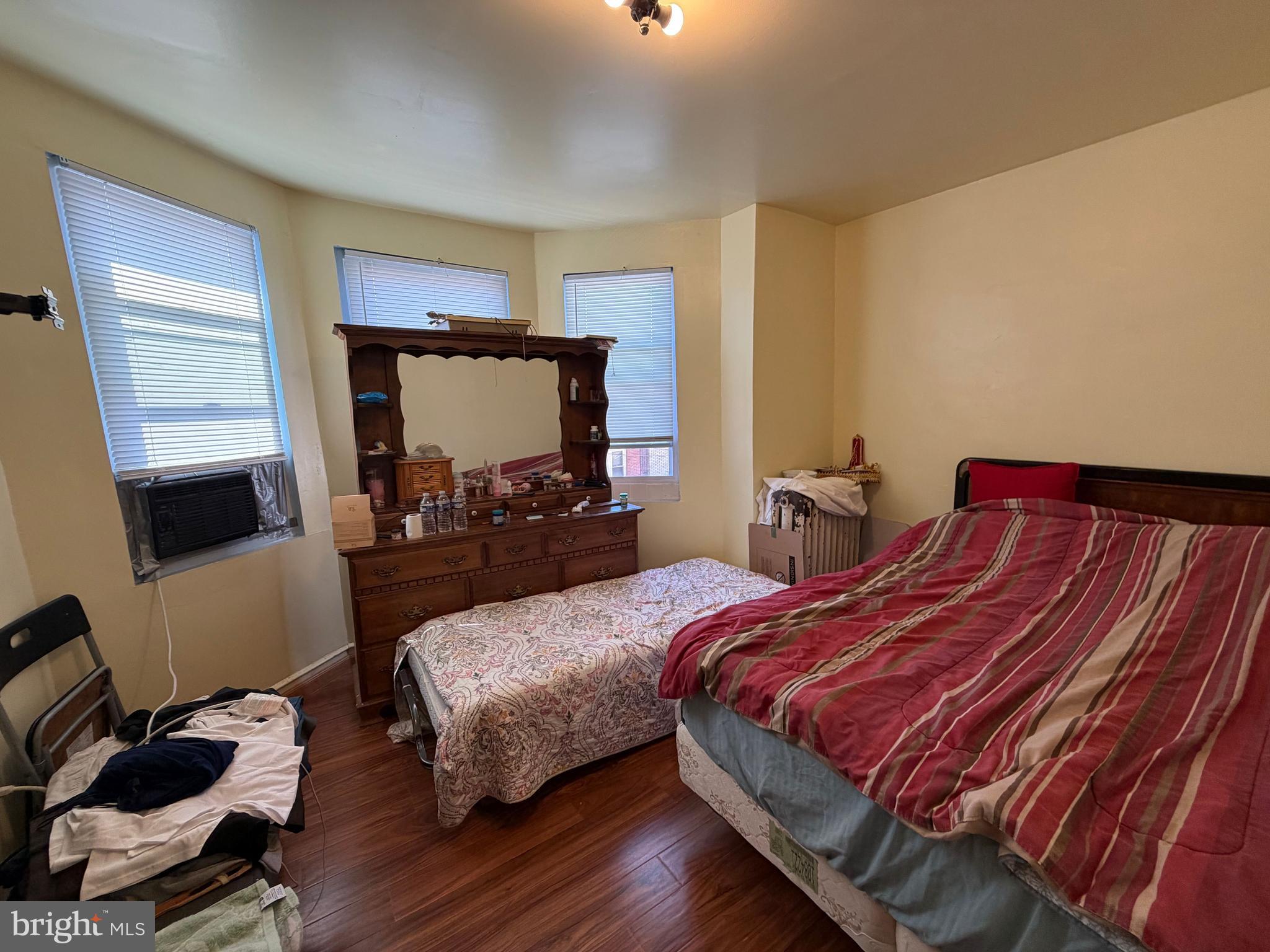 2033 South Bonsall Street Philadelphia, PA 19145 - Photo 14 of 31 a bedroom with two beds and a flat screen tv