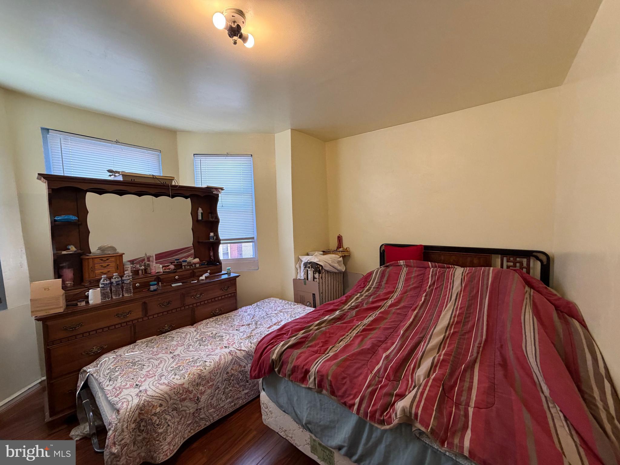 2033 South Bonsall Street Philadelphia, PA 19145 - Photo 15 of 31 a bedroom with bed and mirror