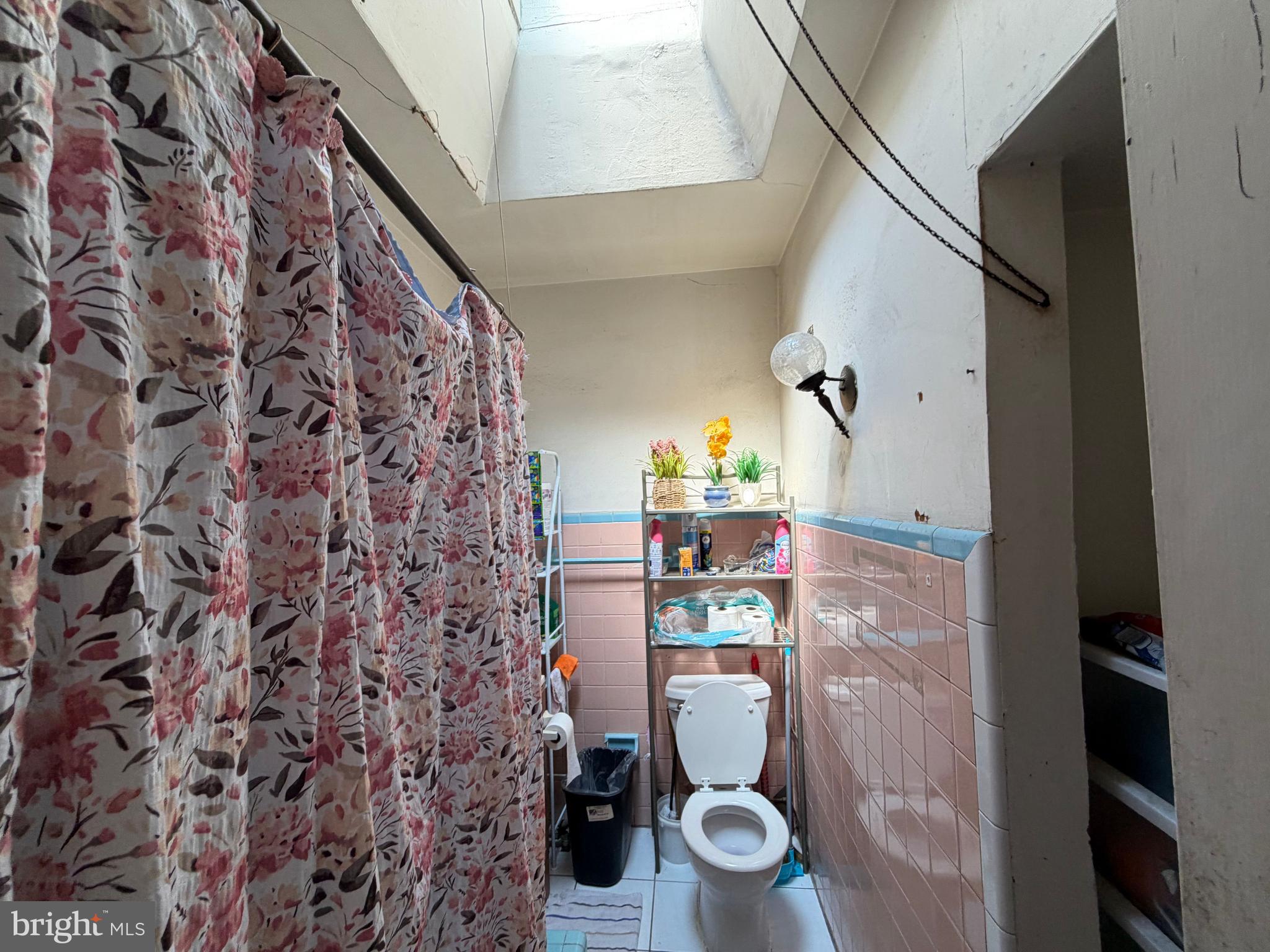 2033 South Bonsall Street Philadelphia, PA 19145 - Photo 16 of 31 a view of bathroom with a toilet and a shower curtain