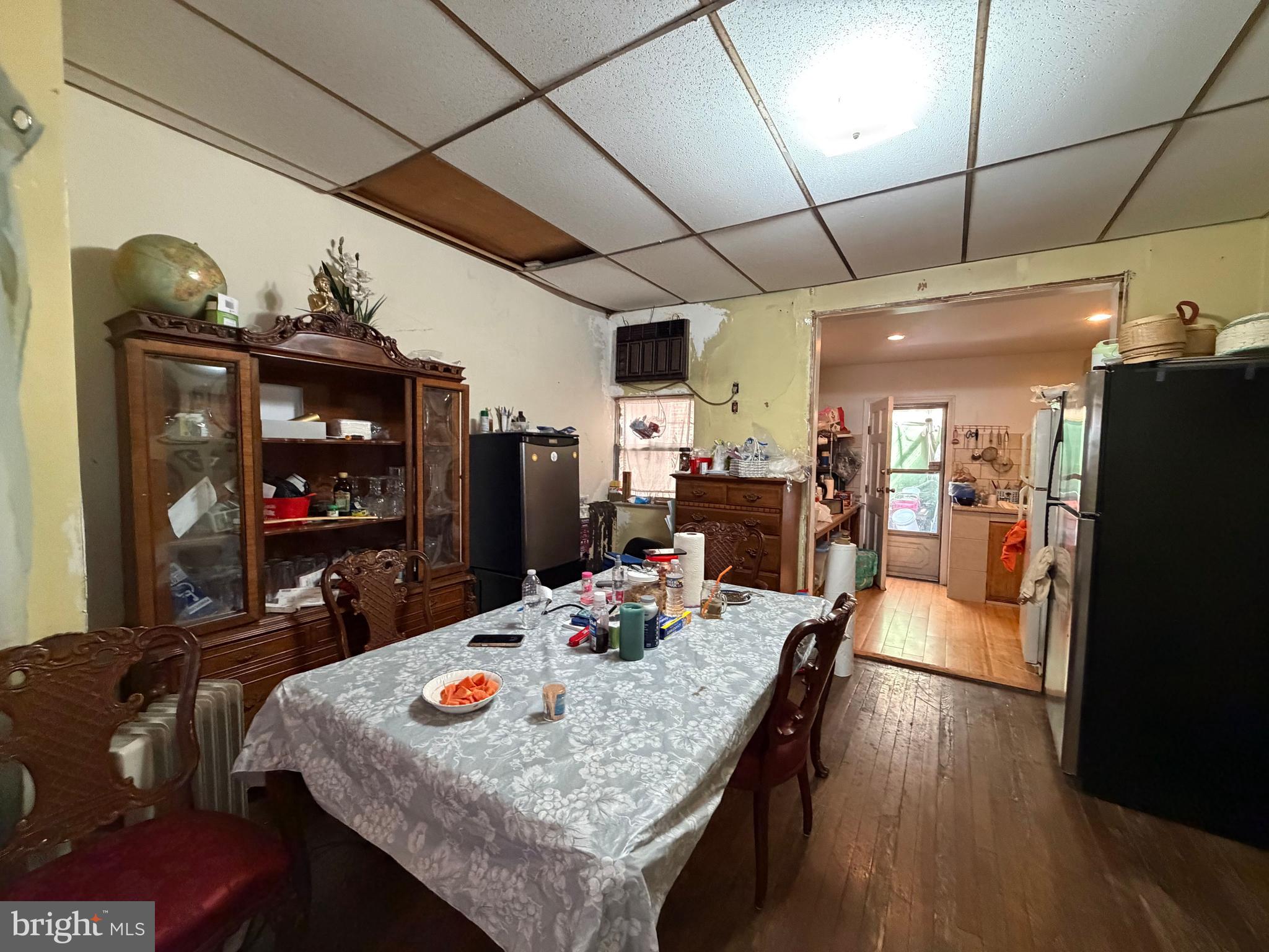 2033 South Bonsall Street Philadelphia, PA 19145 - Photo 5 of 31 a dining room with furniture a kitchen view and a refrigerator