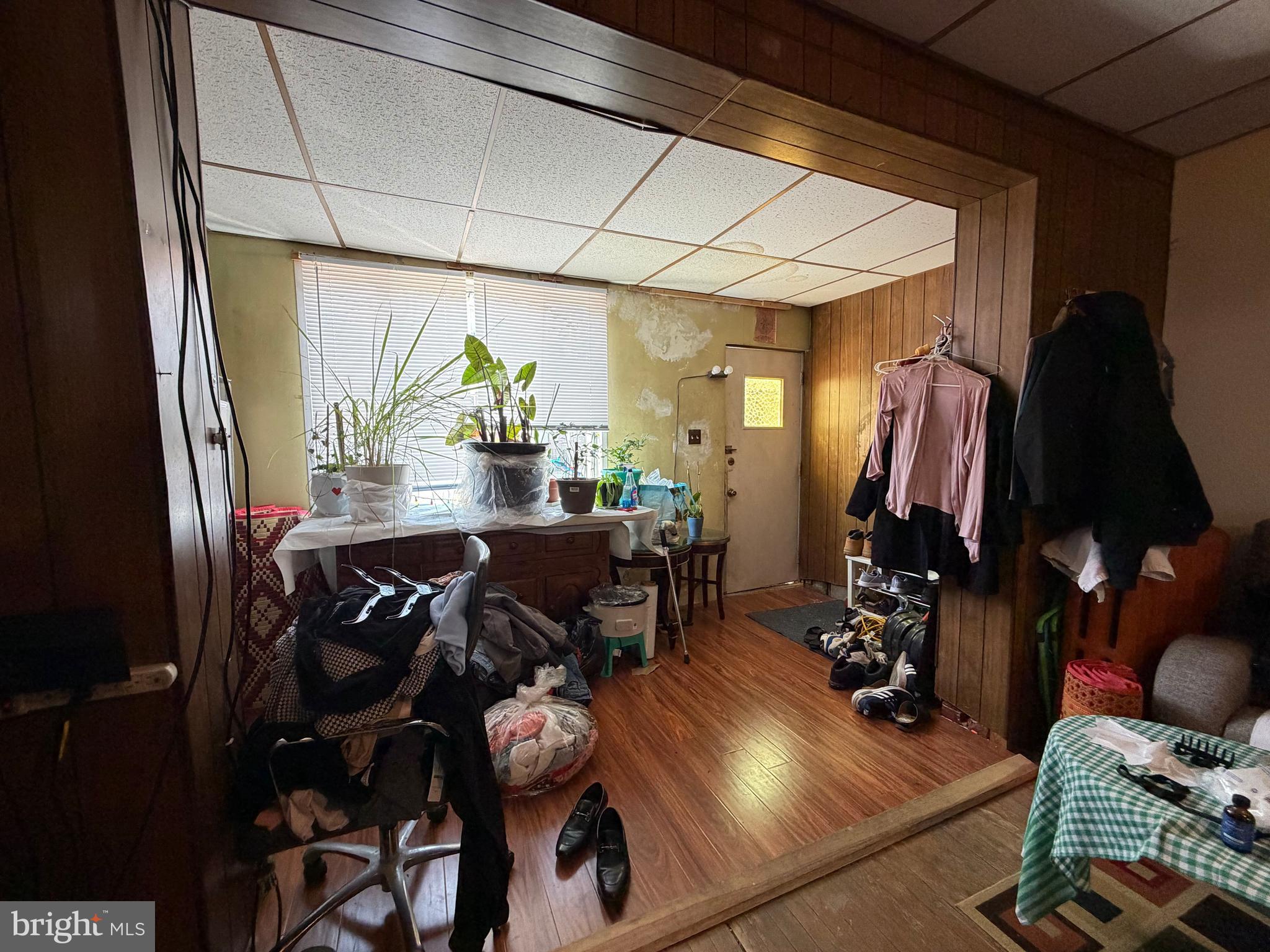 2033 South Bonsall Street Philadelphia, PA 19145 - Photo 6 of 31 a view of living room and dining room with furniture wooden floor and chandelier