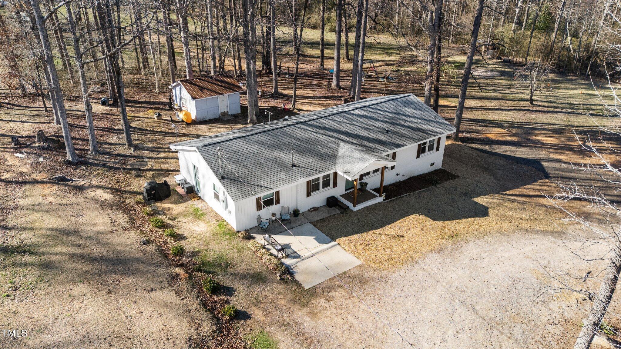 4775 Barber Mill Road Clayton, NC 27520 - Photo 18 of 54 a view of a terrace with wooden fence