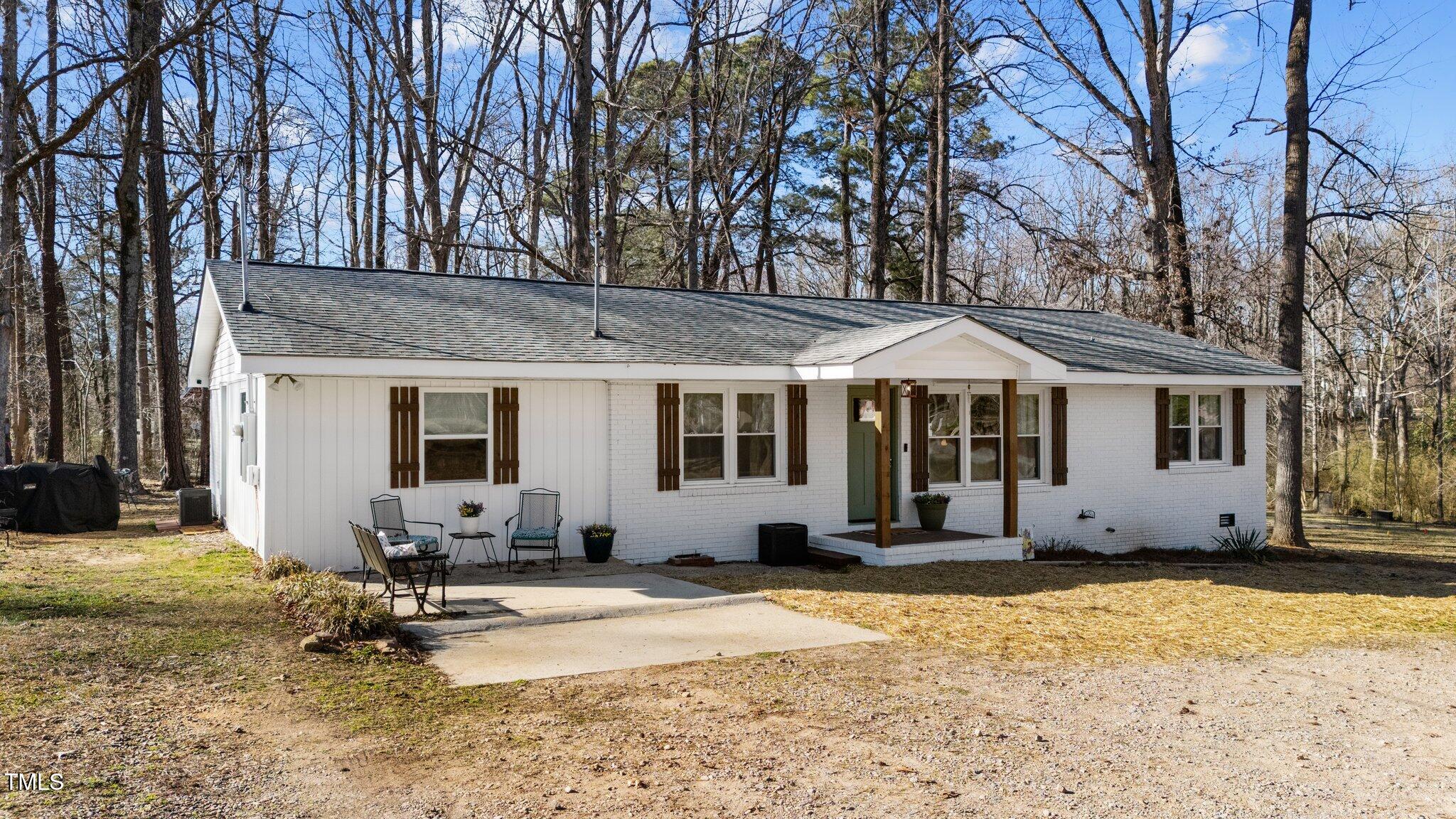 4775 Barber Mill Road Clayton, NC 27520 - Photo 2 of 54 a front view of a house with a yard