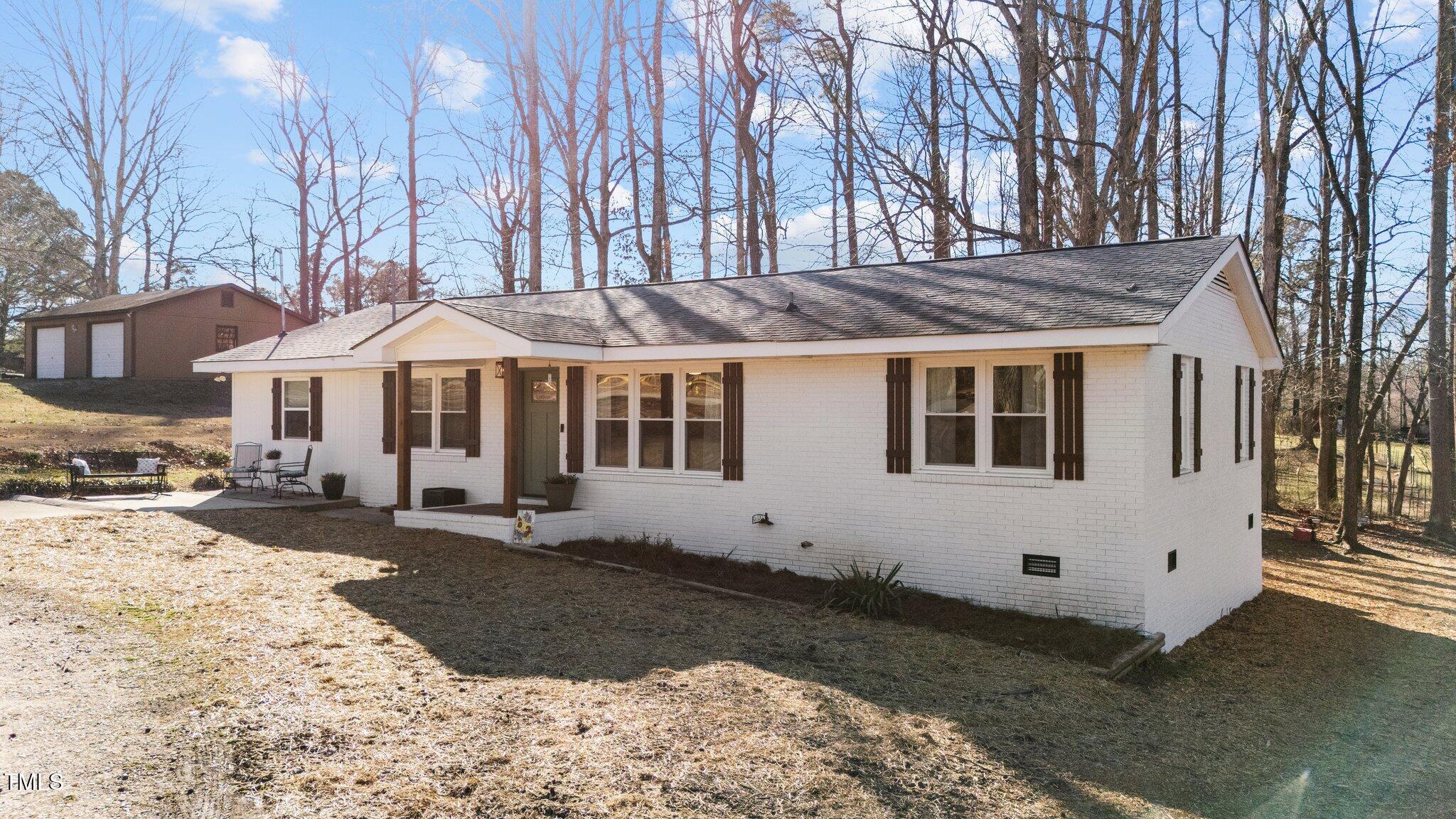 4775 Barber Mill Road Clayton, NC 27520 - Photo 3 of 54 a front view of a house with a yard