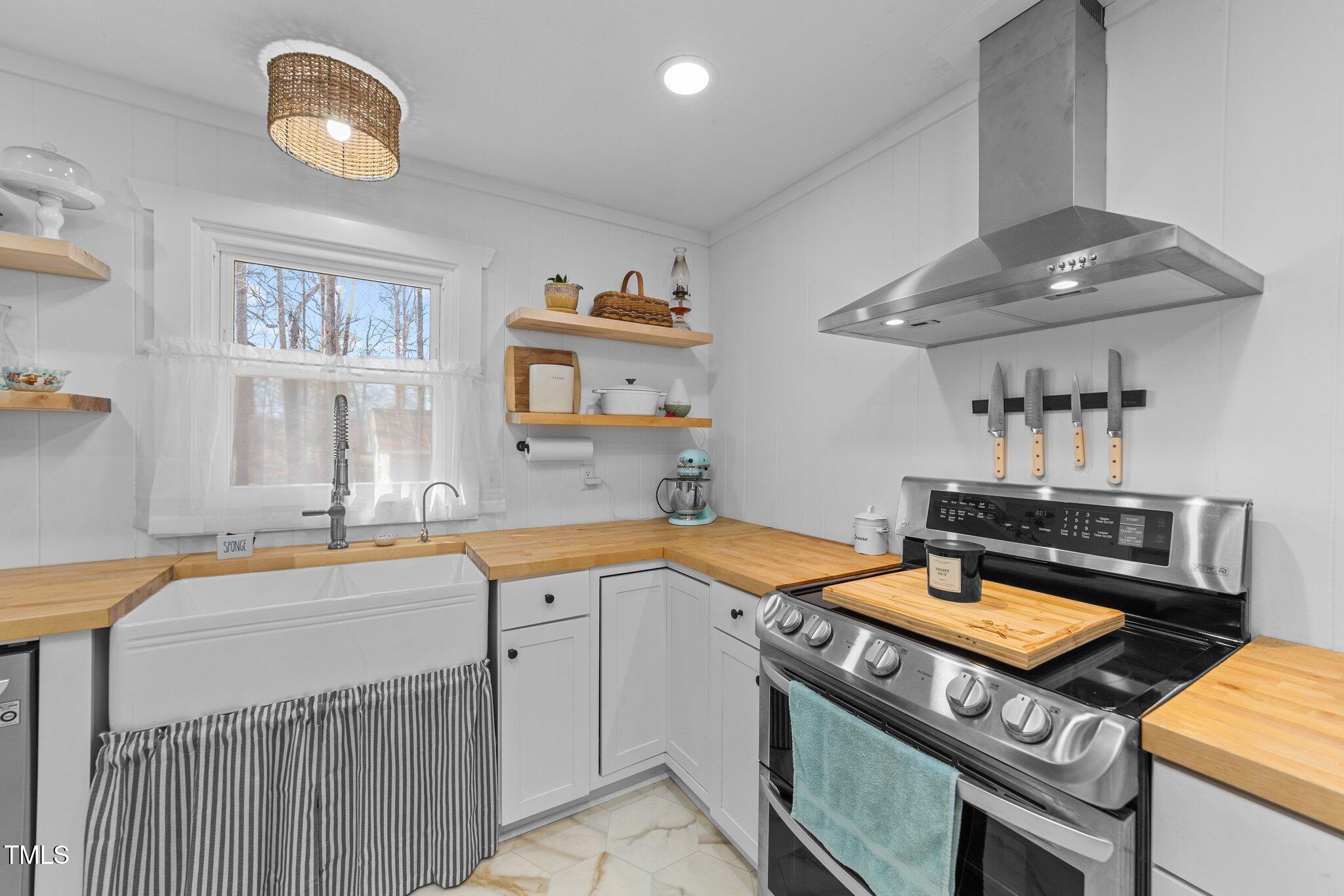 4775 Barber Mill Road Clayton, NC 27520 - Photo 35 of 54 a kitchen with a stove and a sink