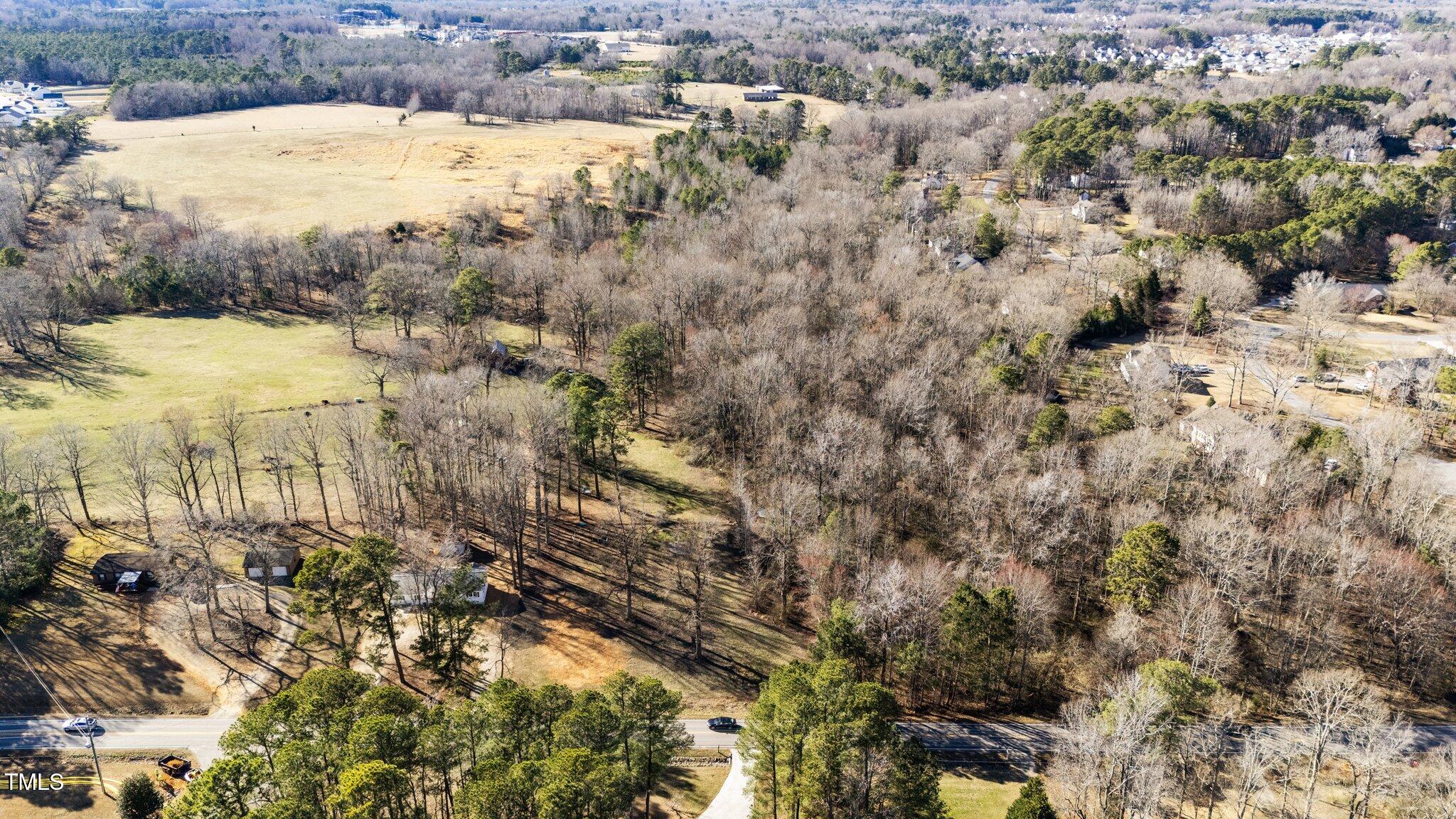 4775 Barber Mill Road Clayton, NC 27520 - Photo 5 of 54 a view of a lake with lots of trees