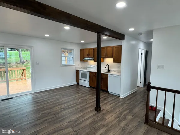 a kitchen with stainless steel appliances granite countertop a refrigerator sink and cabinets