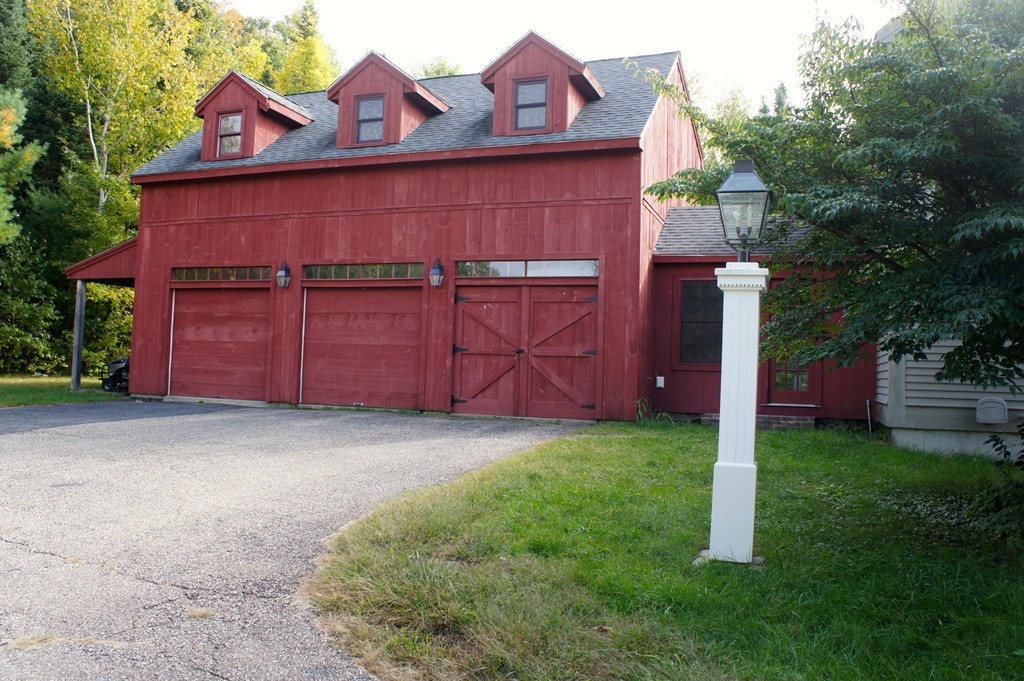 176 Crouch Road Warren, MA 01092 - Photo 18 of 19 a front view of a house with garden