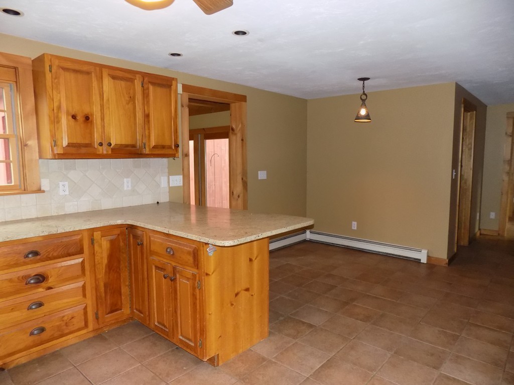 176 Crouch Road Warren, MA 01092 - Photo 4 of 19 a kitchen with stainless steel appliances granite countertop a sink and a cabinets