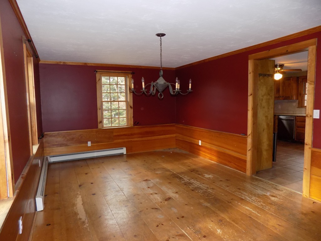 176 Crouch Road Warren, MA 01092 - Photo 5 of 19 a view of an empty room with window and chandelier