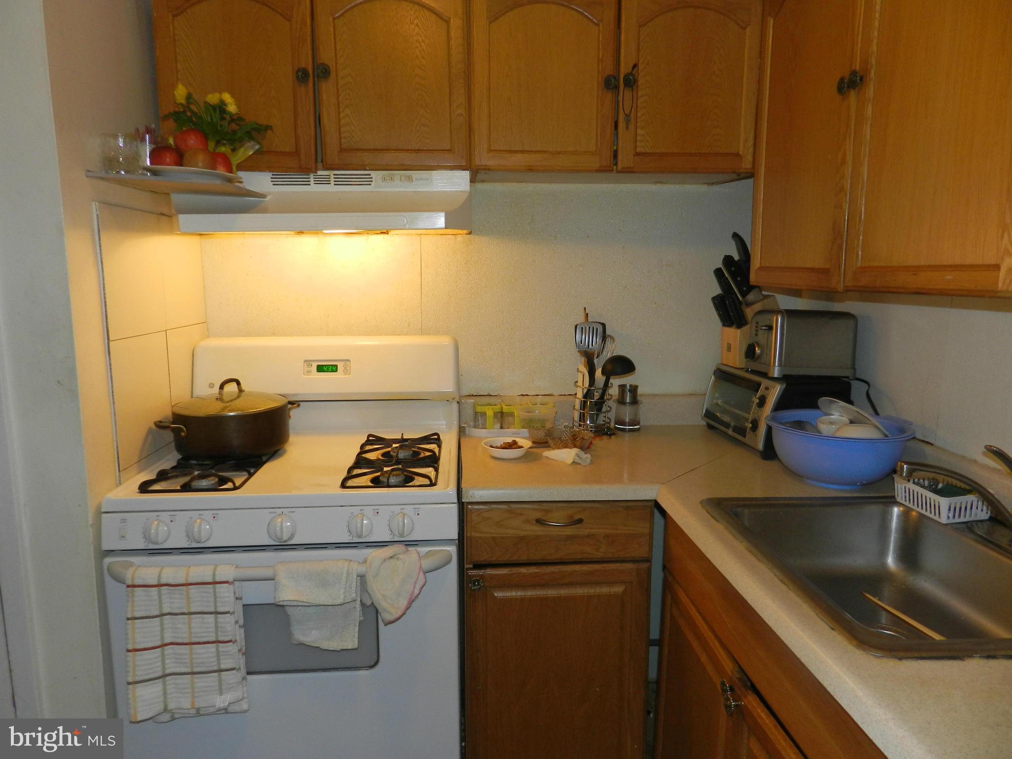 3934 Bel Pre Road, Unit 2 Silver Spring, MD 20906 - Photo 7 of 11 a kitchen with a sink and cabinets