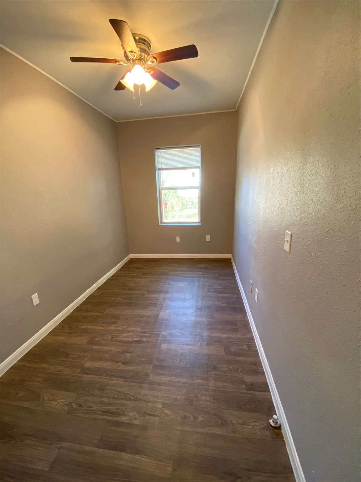 222 Grace Street, Unit 4 Houston, TX 77003 - Photo 2 of 8 a view of room with window and wooden floor