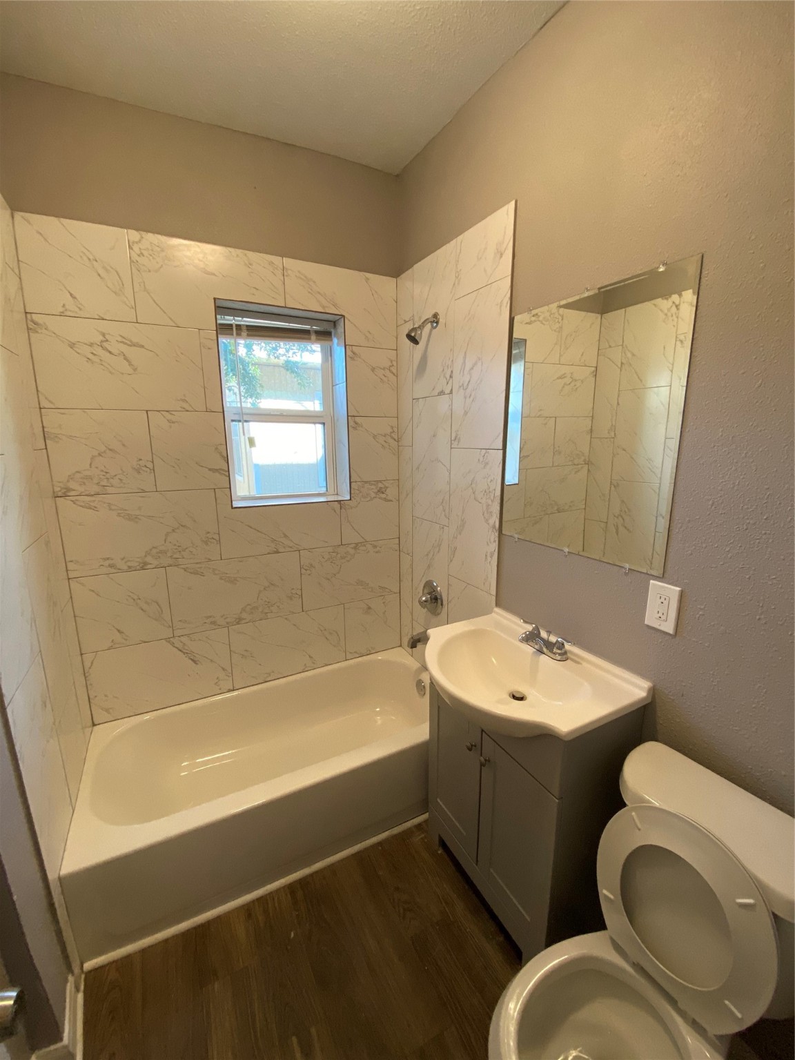 222 Grace Street, Unit 4 Houston, TX 77003 - Photo 3 of 8 a bathroom with a sink a toilet and shower