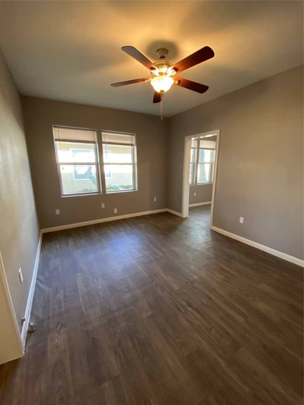 222 Grace Street, Unit 4 Houston, TX 77003 - Photo 5 of 8 a view of an empty room with wooden floor and a window