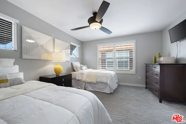 a bedroom with bed and window