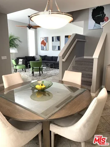 a view of kitchen with dining table and chairs