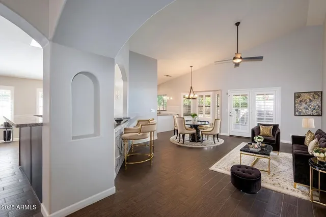 a view of a livingroom with furniture and a window
