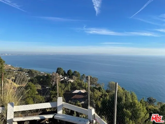 a view of a balcony with an outdoor space
