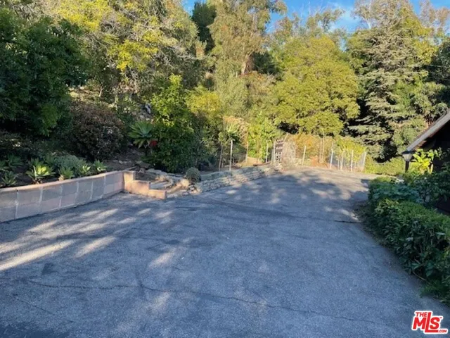 a kitchen with stainless steel appliances a stove and wooden cabinets