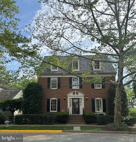 270 Beckwith Street Gaithersburg, MD 20878 - Photo 2 of 7 Classic brick home with lush greenery.
