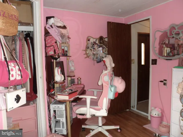 a bathroom with a granite countertop toilet and a sink