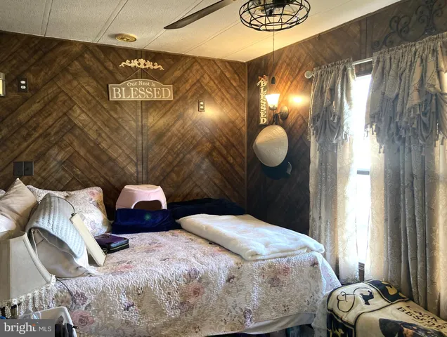 a bedroom with a bed and window