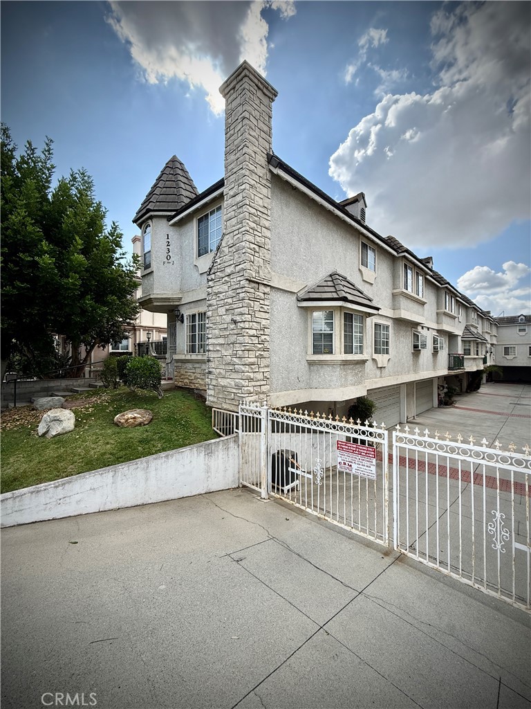 1230 Elm Avenue, Unit G San Gabriel, CA 91775 - Photo 2 of 33 front view of a house with a yard