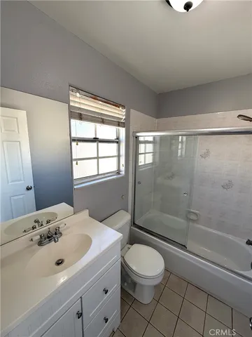 an empty room with a empty space and windows