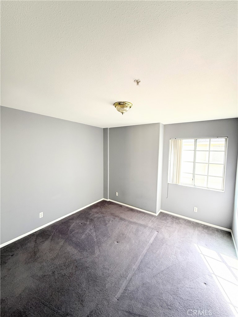1230 Elm Avenue, Unit G San Gabriel, CA 91775 - Photo 22 of 33 an empty room with a empty space and windows