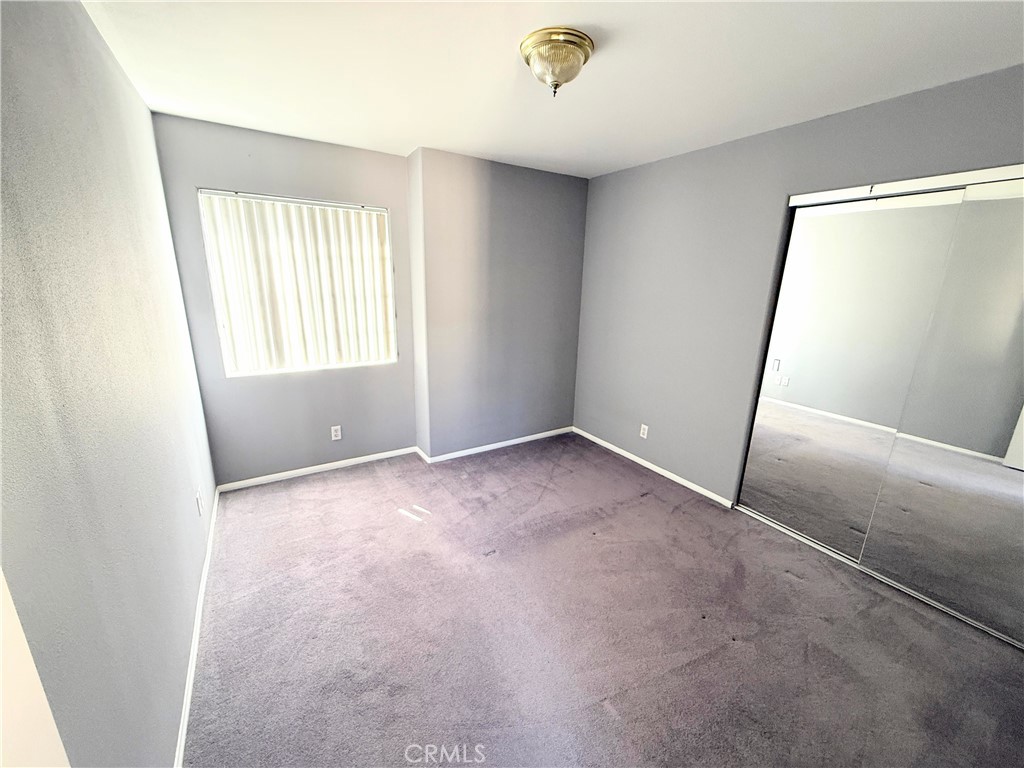 1230 Elm Avenue, Unit G San Gabriel, CA 91775 - Photo 24 of 33 an empty room with windows