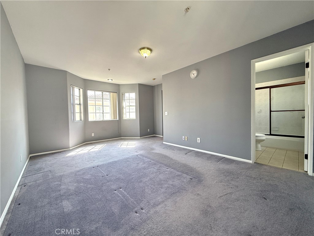1230 Elm Avenue, Unit G San Gabriel, CA 91775 - Photo 26 of 33 a view of an empty room with a window and fireplace