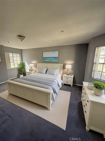 a bathroom with a sink mirror vanity and toilet