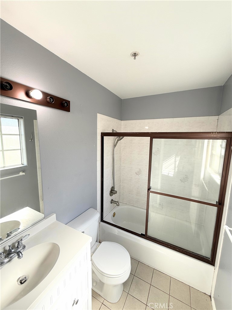 1230 Elm Avenue, Unit G San Gabriel, CA 91775 - Photo 30 of 33 a bathroom with a sink mirror vanity and toilet