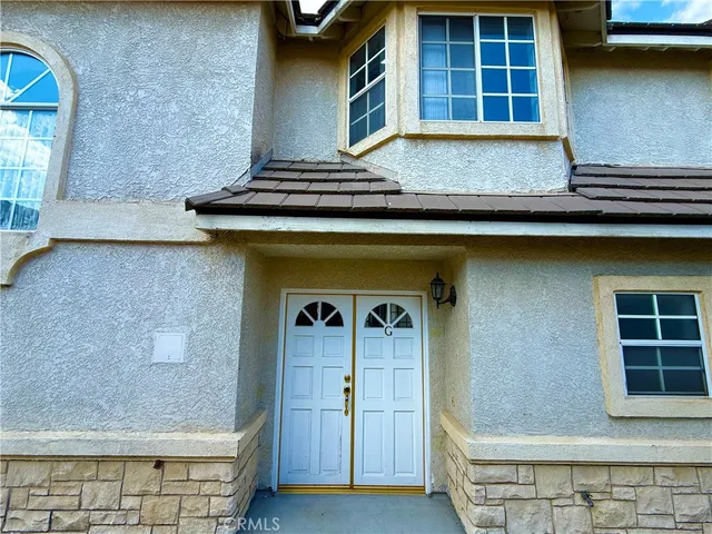 wooden floor fireplace and natural light in room