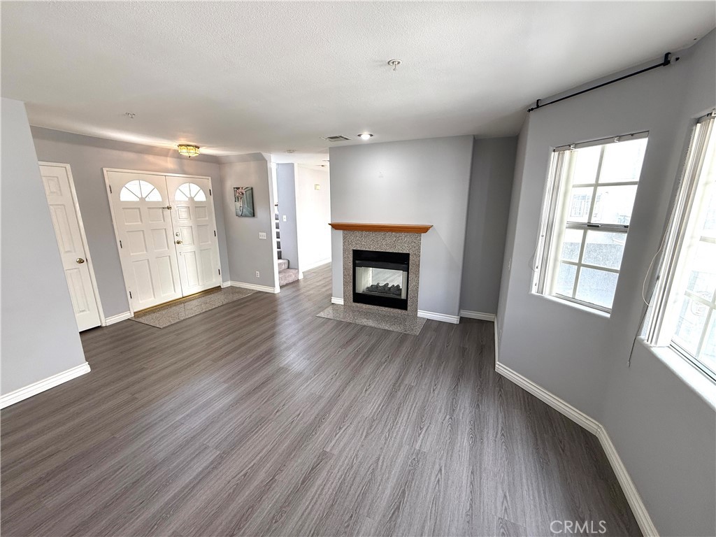 1230 Elm Avenue, Unit G San Gabriel, CA 91775 - Photo 5 of 33 wooden floor fireplace and natural light in room