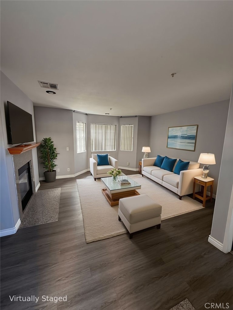 1230 Elm Avenue, Unit G San Gabriel, CA 91775 - Photo 7 of 33 a living room with furniture and a flat screen tv