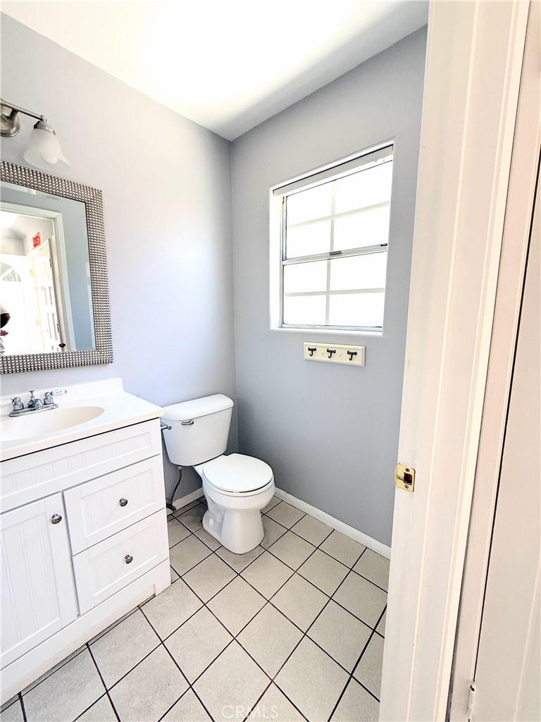 1230 Elm Avenue, Unit G San Gabriel, CA 91775 - Photo 8 of 33 a bathroom with a toilet sink and mirror