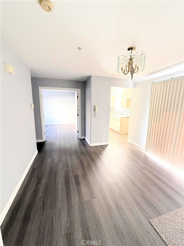 1230 Elm Avenue, Unit G San Gabriel, CA 91775 - Photo 9 of 33 wooden floor in an empty room with a window