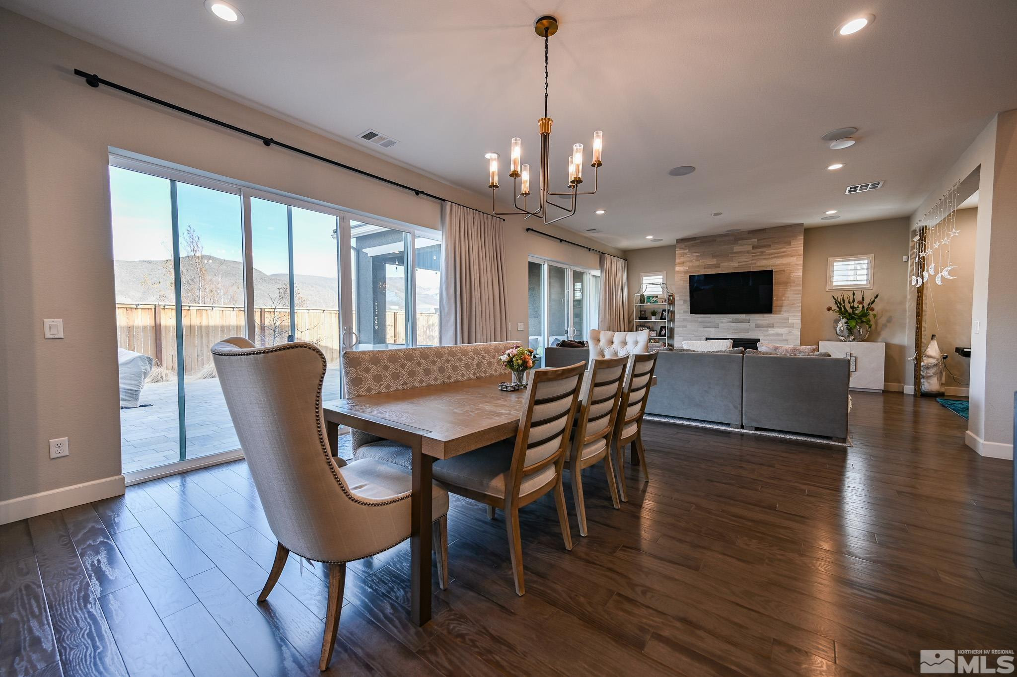 9330 Mayfair Way Reno, NV 89521 - Photo 13 of 40 a view of a dining room with furniture window and wooden floor