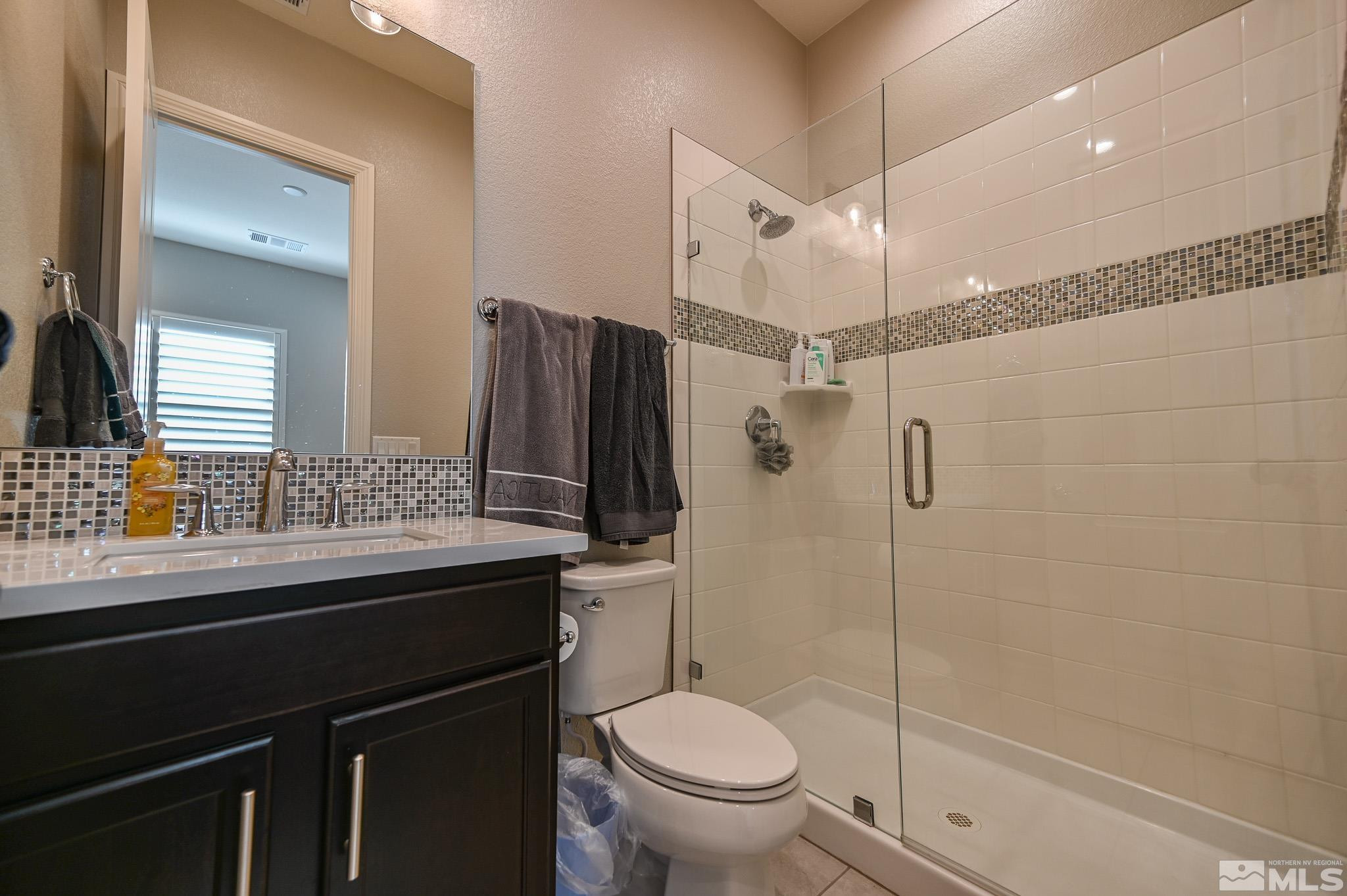 9330 Mayfair Way Reno, NV 89521 - Photo 16 of 40 a bathroom with a sink toilet and shower