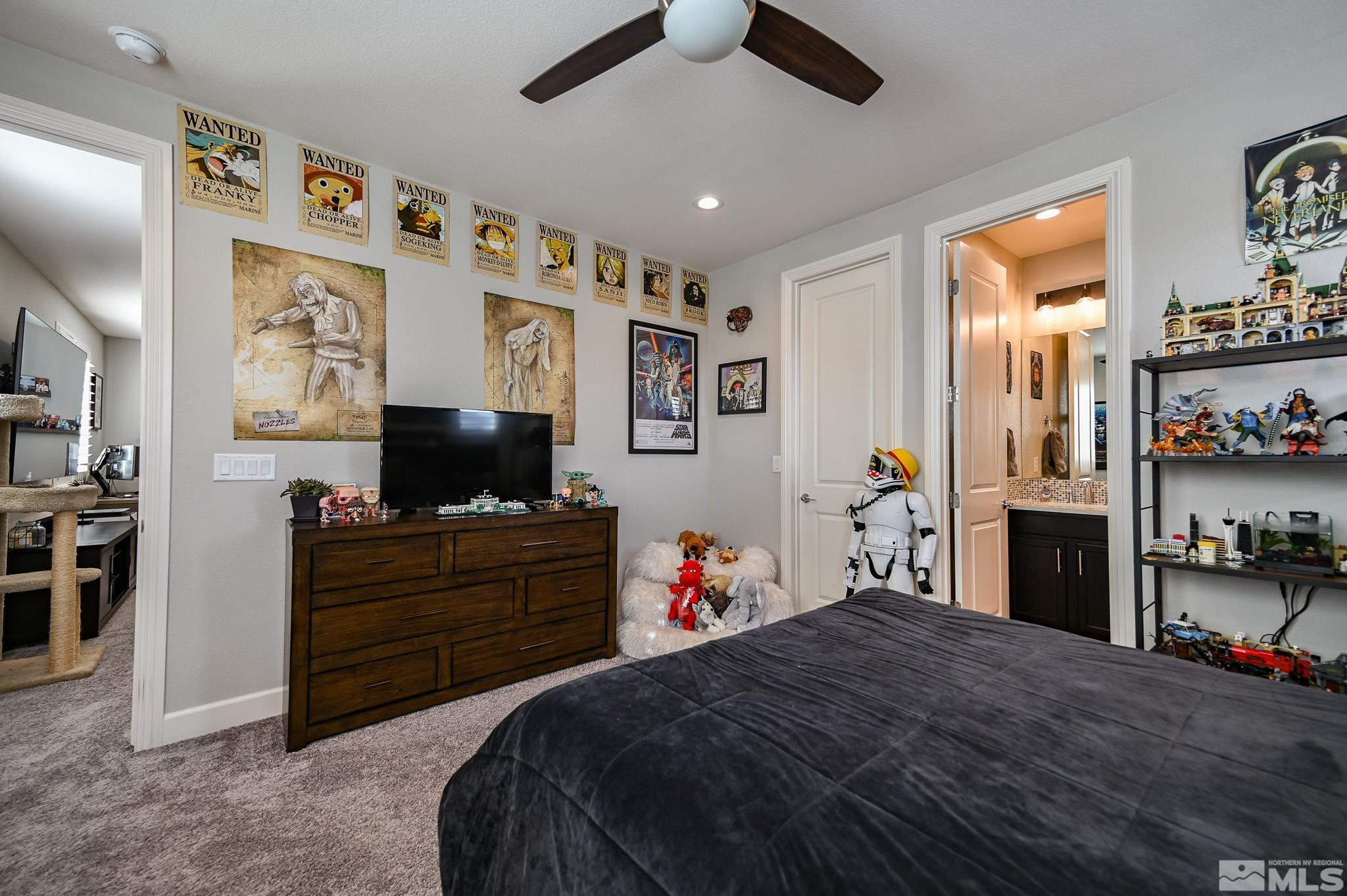 9330 Mayfair Way Reno, NV 89521 - Photo 20 of 40 a bedroom with a bed and a flat screen tv