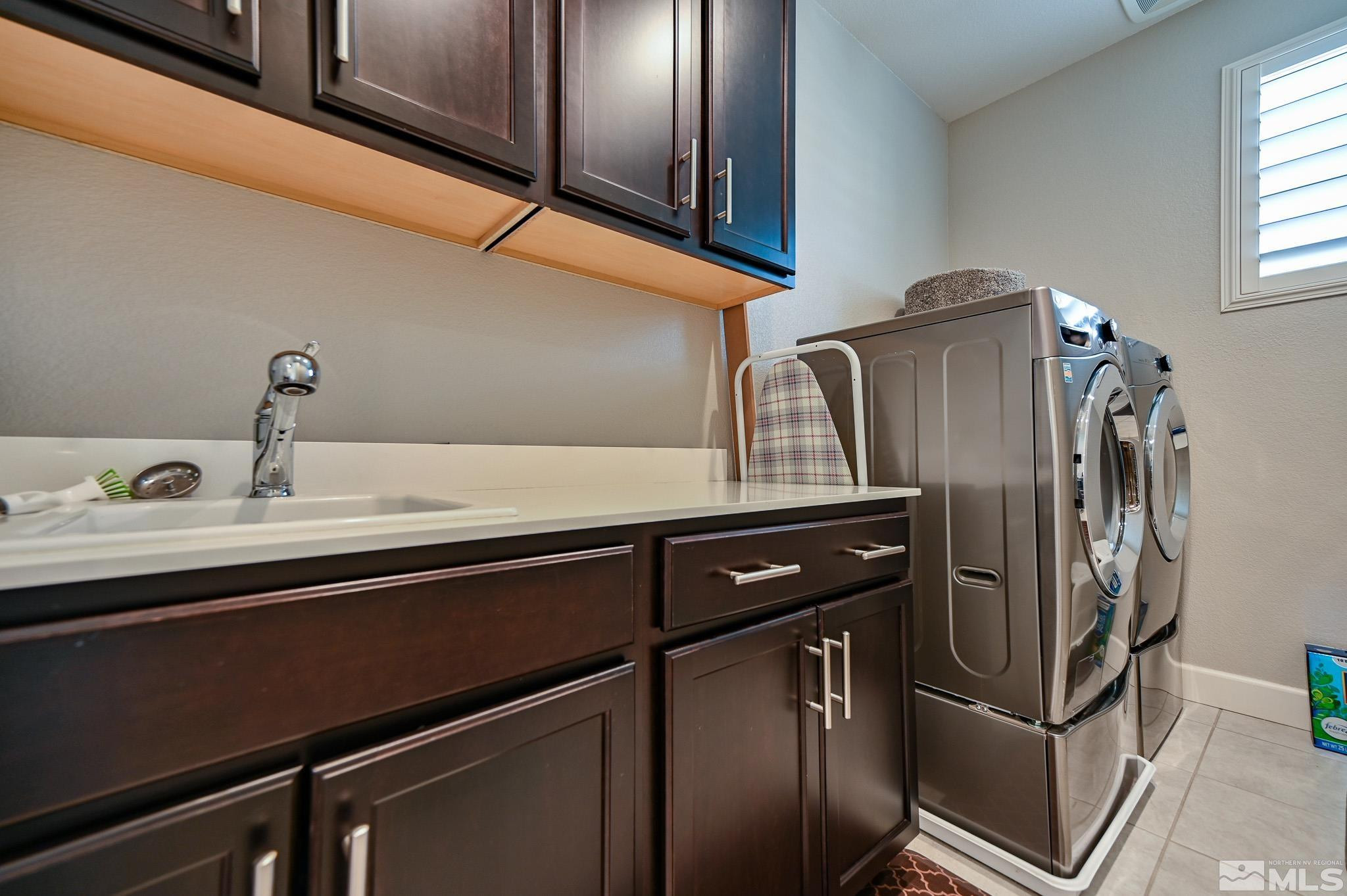 9330 Mayfair Way Reno, NV 89521 - Photo 25 of 40 a kitchen with stainless steel appliances granite countertop a refrigerator and a sink
