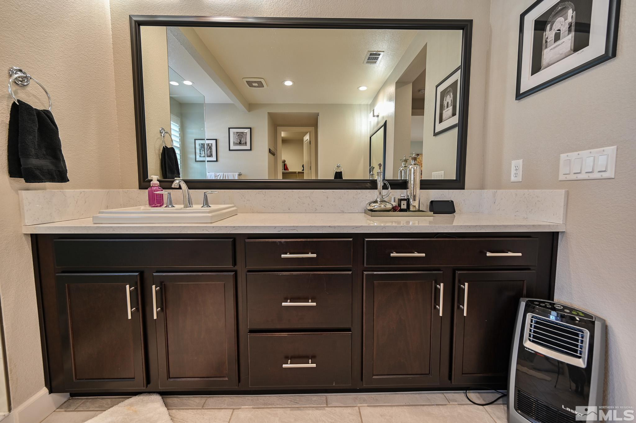 9330 Mayfair Way Reno, NV 89521 - Photo 33 of 40 a bathroom with a sink and a mirror